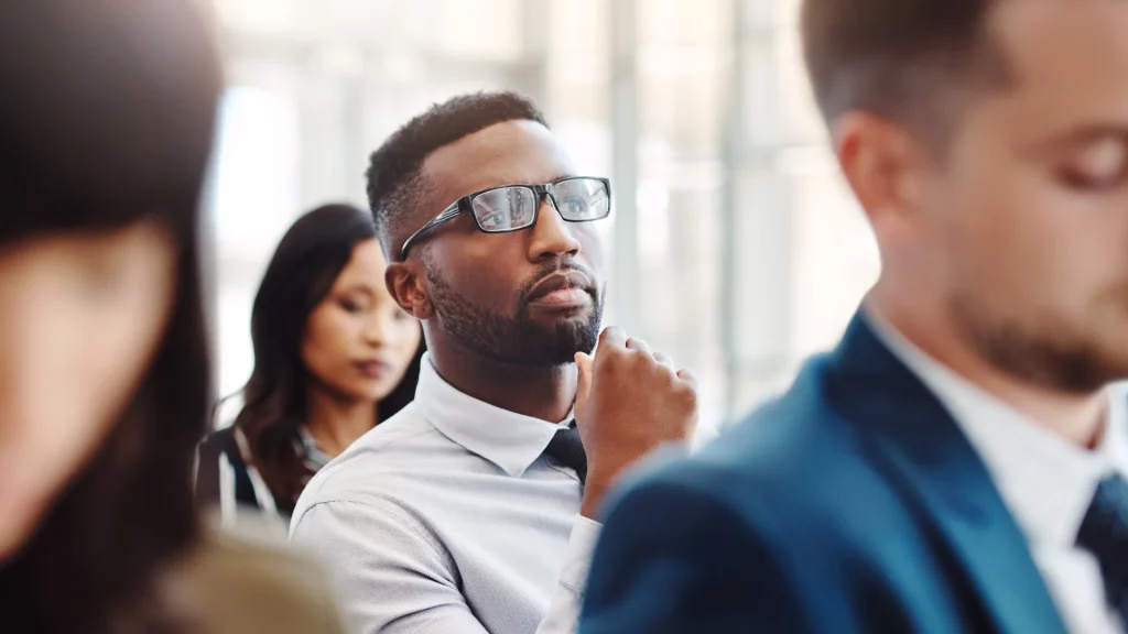 Curious man at a presentation